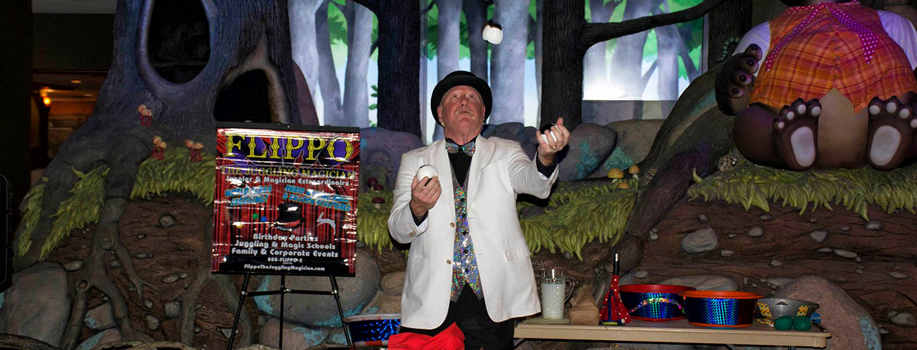 Flippo juggling balls at a performance